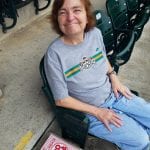 Senior woman smiling at baseball game