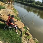 Woman fishing at river